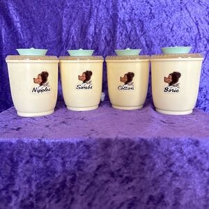 Set of 4 vintage plastic Tommee Tippee baby storage containers with lids
